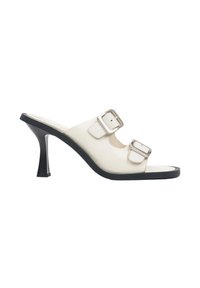 White heeled mules with two adjustable straps and silver buckles. Glossy finish, open toe design, and a black textured sole.