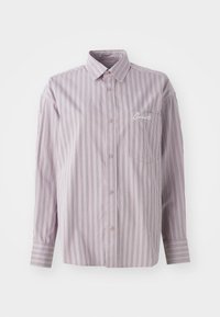 Button-up shirt in lavender with vertical stripes in dark gray. Features a small chest pocket and embroidered logo on the left side.