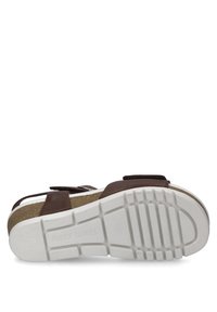 Hnědé kožené sandály s nastavitelnými popruhy, korkovou stélkou a texturovanou bílou gumovou podrážkou se vzorem pro lepší trakci.