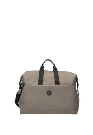 Beige sporttas van glad materiaal met dubbele zwarte handgrepen, verstelbare schouderriem en een voorvak met rits. Bevat een logo-detail.