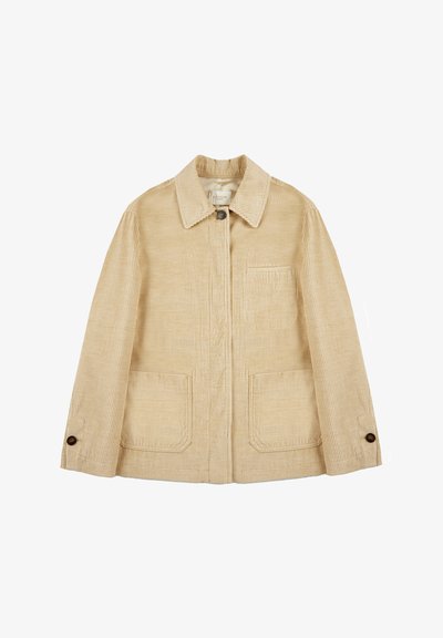 Beige corduroy jack met een kraag, twee voorzakken en knoopdetails op de mouwen. Heeft een verticale ribbeltextuur en een enkele borstzak.