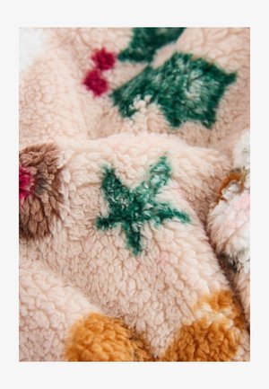 Minkštas rožinis pledas su žalių ir raudonų lapų raštais. Faktūruota medžiaga apima rudos ir oranžinės atspalvius.