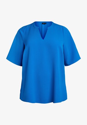 Niebieska bluzka z krótkim rękawem w kształcie litery V, uszyta z fakturowanej tkaniny. Luźny krój z zaokrąglonym dołem i delikatnymi bocznymi rozcięciami.