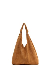 Suede hobo bag in warm brown. Features a slouchy shape, knotted top handles, and a central cutout for easy access. Smooth texture, minimal accents.