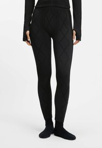 Czarne legginsy wykonane z teksturowanej tkaniny, ozdobione wzorem diamentu i dopasowanym krojem. Długość do kostek, z miękkim wykończeniem.