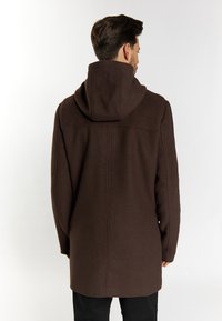 Brown wool coat with a high collar and hood, featuring a straight shape and minimal stitching details. The texture appears soft and thick.