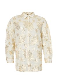 Blusa blanca con bordado de coral dorado y estrellas de mar. Presenta un cierre frontal de botones y un cuello clásico con mangas tres cuartos.