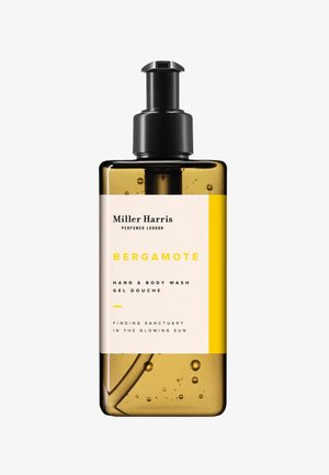 Bergamotte Hand- und Körperwaschmittel in einer transparenten Amberflasche mit schwarzem Pumpkopf, versehen mit einem cremefarbenen Etikett und gelben Akzenten.