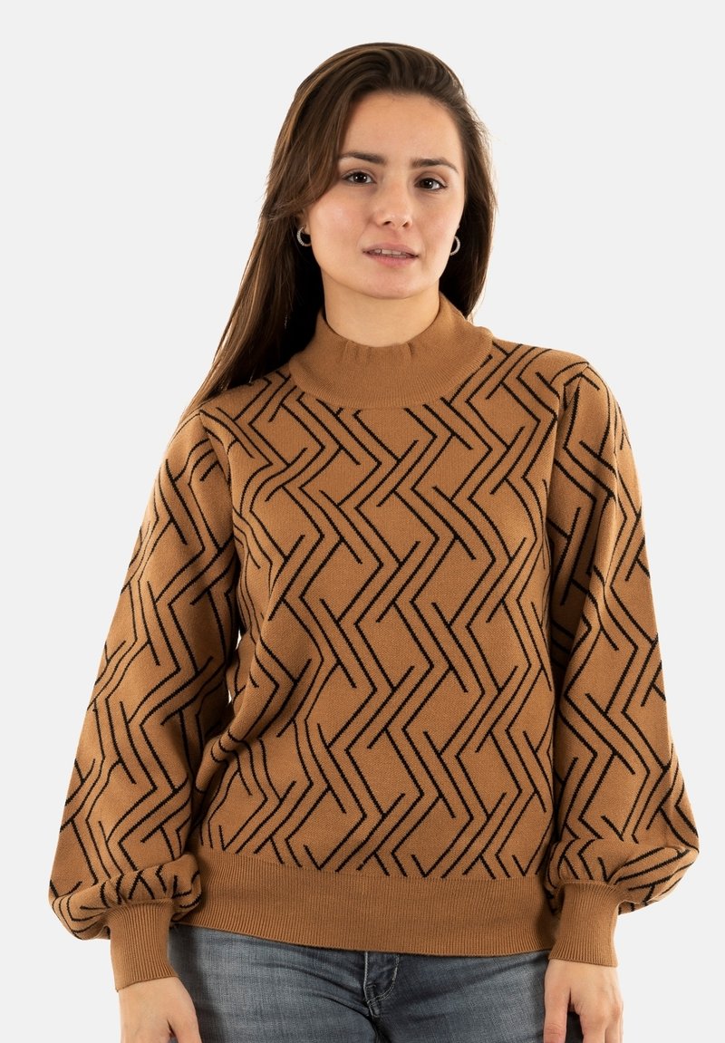 Suéter marrón de punto con patrón de zigzag negro, cuello alto y mangas abullonadas, con dobladillo y puños acanalados.