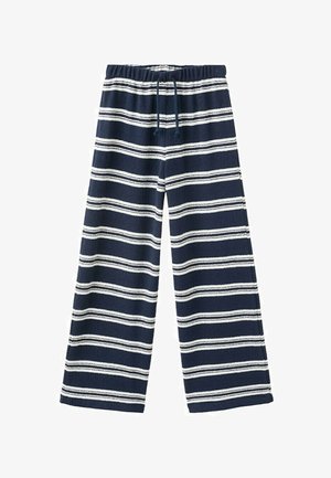 Pantalon large bleu marine avec des rayures horizontales blanches et une taille élastique munie d'un cordon noir.
