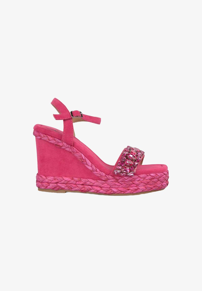 Pink wedge sandals featuring a braided jute sole, fabric upper, adjustable ankle strap, and a decorative beaded accent on the front strap.