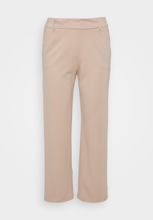 Pantaloni beige a gamba larga realizzati in tessuto morbido; presentano una vita liscia e tasche laterali, con una silhouette pulita e su misura.
