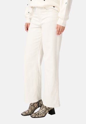 NOT TRANSLATED - Flared Jeans - sand