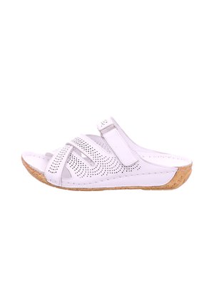 White leather slide sandal with perforated design, adjustable strap, and cork sole, featuring a contoured shape for comfort.