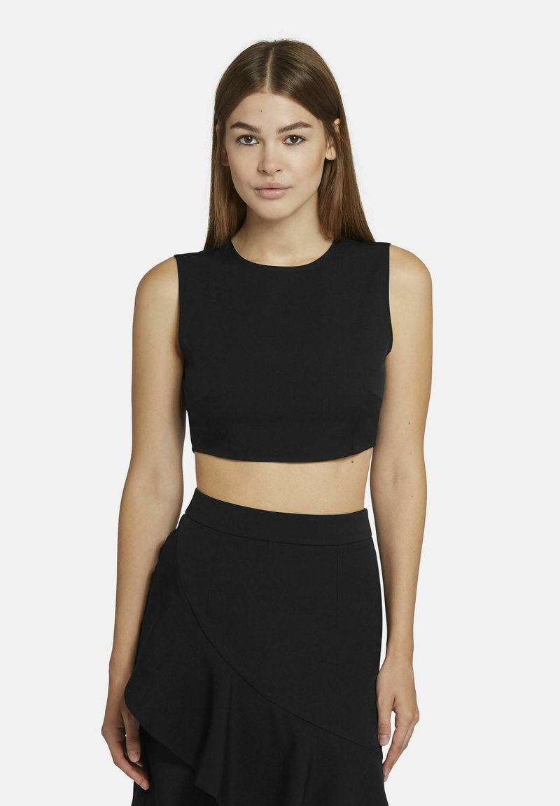 Zwart cropped top met een ronde halslijn en mouwloos ontwerp, gemaakt van een gladde, strakke stof. Past bij een bijpassende rok.