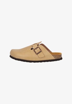 Beige leather clogs with a rounded toe, adjustable buckle strap, and brown cork footbed. Flat rubber outsole with textured detail.