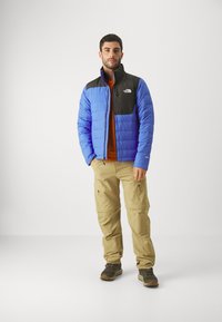 The North Face ACONCAGUA POCKET JACKET - Pūkinė striukė - solar blue/black