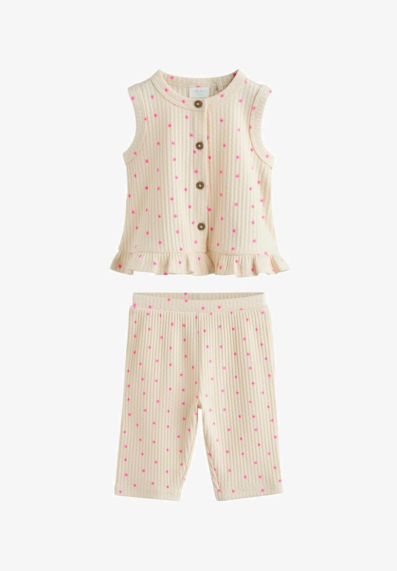 Ärmelloses cremefarbenes geripptes Oberteil mit pinken Punkten, Knöpfen vorne, gerafftem Saum und passenden gerippten Shorts mit pinken Punkten.