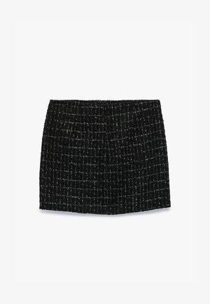 Mustat tweed-minihameet, joissa on tekstuuripinta, ruutukuvio ja suora leikkaus, sopivat erilaisiin tilaisuuksiin.