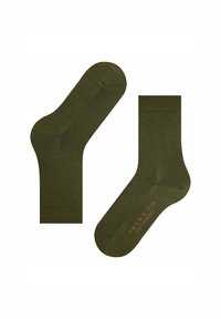 Para oliwkowych skarpetek do połowy łydki leżących płasko, jedna z nich pokazuje spód z rozmiarem i tekstem marki w stonowanym pomarańczowym kolorze.