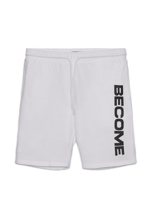 Pantaloncini bianchi in cotone con vita elasticizzata e coulisse. Presentano la scritta nera in grassetto "BECOME" sulla gamba sinistra. Design semplice, vestibilità regolare.