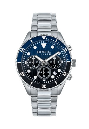 Montre BreiL Tribe avec un cadran bleu foncé, un bracelet en acier inoxydable, des sous-cadrans noirs et une lunette texturée. Elle possède des marqueurs lumineux pour une meilleure visibilité.