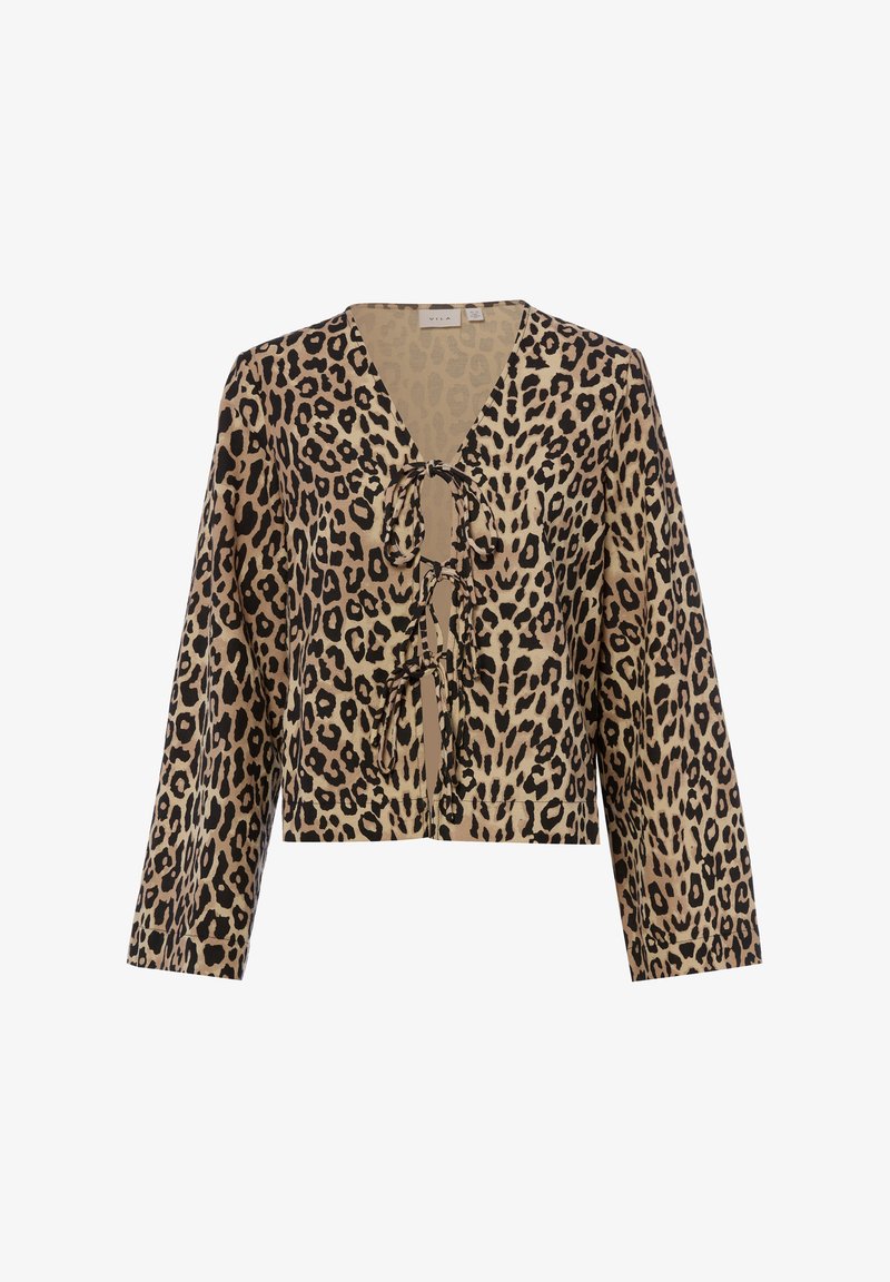 Blouse à manches longues imprimée léopard avec col en V et trois fermetures à nouer à l'avant, en beige, noir et marron.