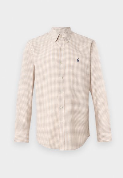 Camisa de cuadros beige claro con mangas largas, cuello abotonado y pequeño logo azul marino. Tejido de algodón, corte clásico, botones lisos.