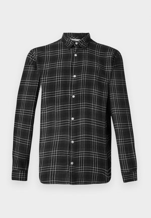Chemise à carreaux noir et blanc à boutons. Manches longues, col et fermeture à cinq boutons à l'avant. Tissu doux avec une texture lisse et coupe régulière.