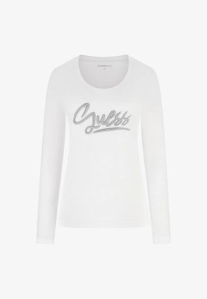 Hvid langærmet t-shirt med rund halsudskæring og sølvfarvet "Guess"-logo lavet af rhinsten på tværs af brystet. Blød stoffinish.