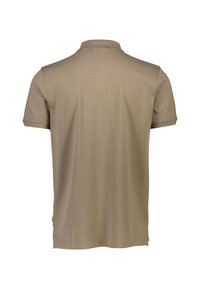 Beige pikétröja i mjuk bomullsstof, med klassisk krage och korta ärmar. Bakifrån visar den minimal detaljering och rena linjer.