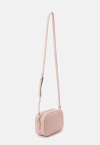 Pink rectangular crossbody bag made of textured leather, featuring a gold zipper, adjustable strap, and smooth surface.