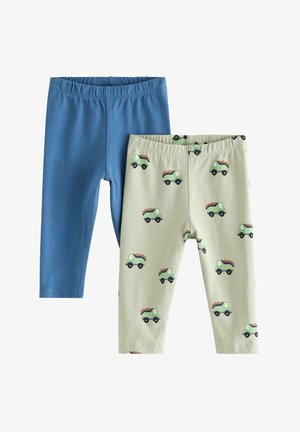 To sæt leggings: det ene i ensfarvet blå, det andet i lys grøn med et lastbilmønster. Begge har elastisk talje og en glat bomuldsstruktur.