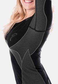 Black athletic top with long sleeves, featuring gray textured patterns and accent lines. Smooth fabric, shaping fit, and crew neck design.