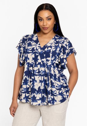 Blouse à manches courtes, bleu marine et crème à motif, avec un col en V et une taille froncée. Tissu doux et léger avec un design fluide.