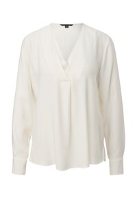 Blouse blanche avec un col en V, manches longues et coupe décontractée. Confectionnée en tissu lisse ; comporte un pli central subtil.