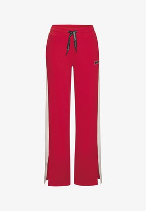 Red wide-leg sweatpants with white side panels, black drawstring, and small logo patch on the right thigh.