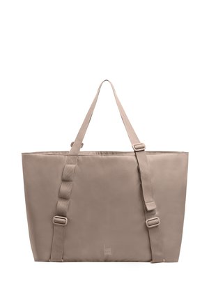 Borsa a tracolla rettangolare beige con due spallacci regolabili e un logo verticale minimalista vicino al centro in basso.