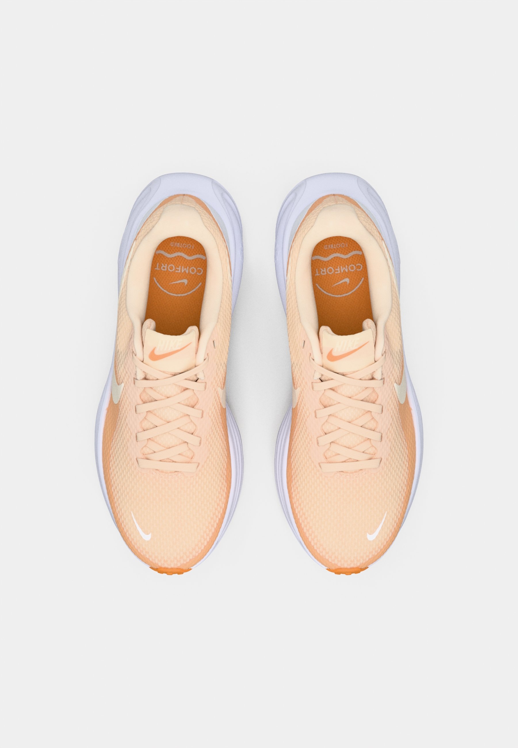peach colored nike shoes