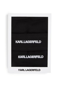 Mustat neulepannan, joissa on valkoisella brodeerattu "KARL LAGERFELD". Pakattu valkoiseen suorakaiteen muotoiseen laatikkoon, jossa on musta teksti.