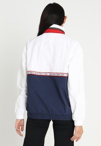 Tommy Jeans Větrovka - dark blue