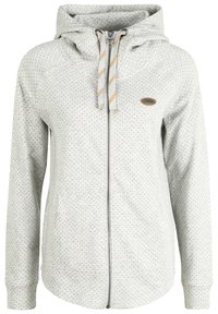 Sweat à capuche gris clair zippé, avec une capuche, présentant un motif à points, des poignets côtelés, des poches avant, et des cordons de serrage contrastants avec un patch logo.