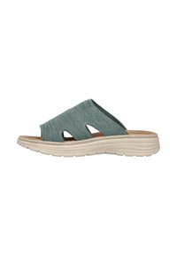 Light blue slip-on sandal with a textured fabric upper, two openings on the sides, and a cushioned cream-colored sole.