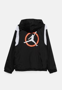 Black hooded jacket featuring a large white Jumpman logo inside an orange circle on the back, with white accents on the shoulders.