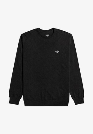 Svart tröja med rund halsringning, långa ärmar och ribbade muddar. Har en liten vit diamantlogotyp på bröstet. Mjuk textur.