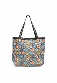 Bolso tote estampado hecho de tela con un diseño colorido que presenta formas geométricas, flores y acentos circulares. Asas negras con logo.