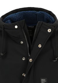 Black jacket with a fleece-lined collar, featuring a front zipper, snap buttons, and decorative stitching. Label visible inside.