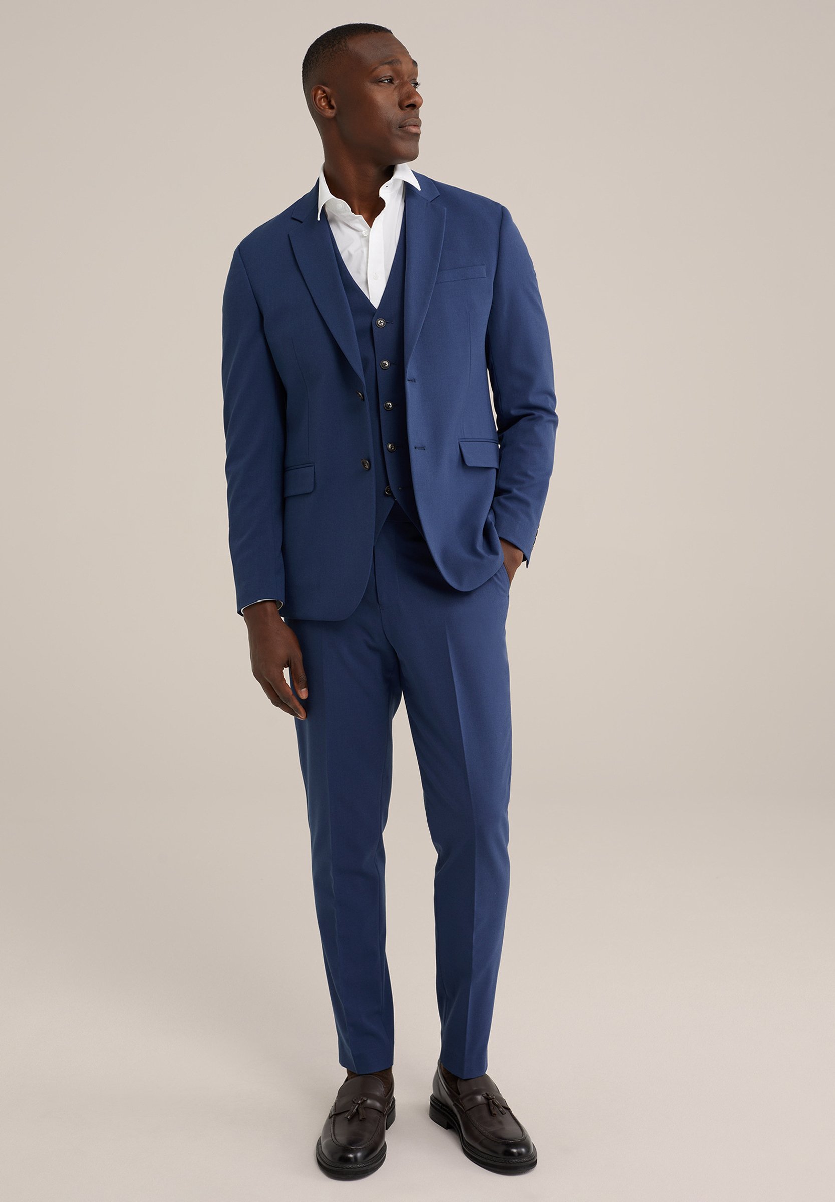 suit with waistcoat and tie