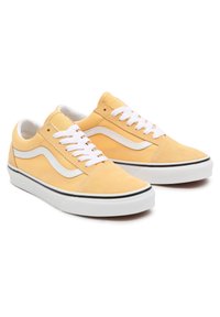 Yellow suede sneakers featuring white laces and side stripes, with a low profile and black rubber sole. Textured fabric and contrasting details.
