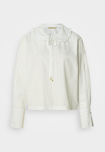 Blouse rayée blanche avec un col festonné, des manches longues et une fermeture à nouer. Dotée de détails dorés et d'une coupe décontractée.